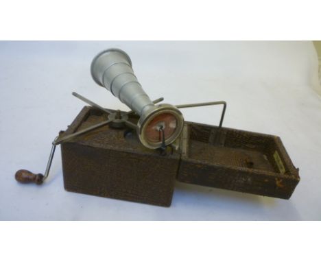 A Peter Pan "Camera" gramophone with fold-out brown leather cloth covered wood case, nickel plated interior fittings, telesco