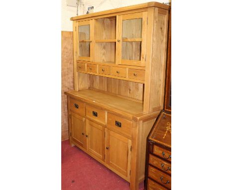 A contemporary light oak kitchen dresser, width 151cm