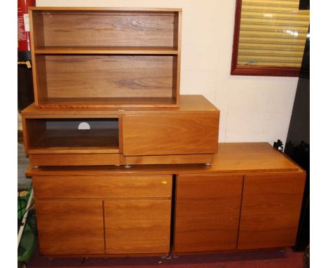 A collection of 1970s Tapley teak modular wall furniture, to include; long low side cupboard, media unit, and a further open 