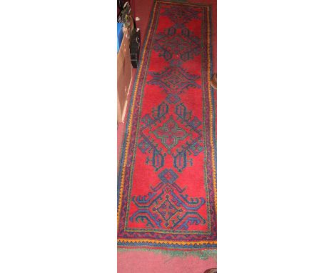 A Turkish woollen red ground hall runner, 270 x 70cm 
