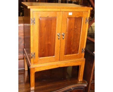 A mid-oak low double door side cupboard, width 56cmCondition report: Height 78cm, depth 40cm.No central shelf.No backboard, s