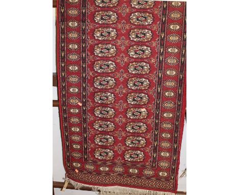A Persian woollen Bokhara hall runner, 77 x 245cm 