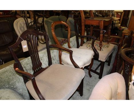 A collection of various 19th century chairs to include; a Hepplewhite mahogany elbow chair, a pair of Victorian mahogany ball