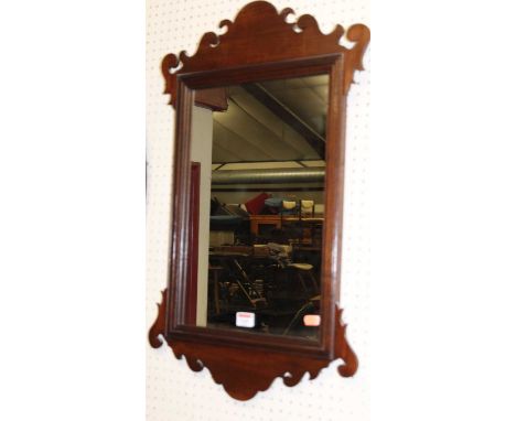 A Chippendale style mahogany fret carved wall mirror, 72 x 44cm