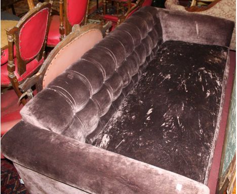 A John Sankey velour plush button back upholstered four seater sofa, raised on tapering block supports, width 235cm