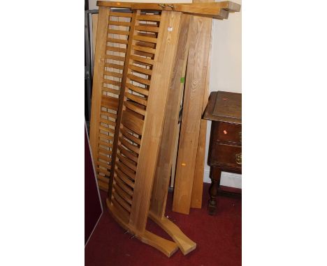 A contemporary light oak slatted king size bedstead, having side rails and twin slatted base sectionCondition report: All par
