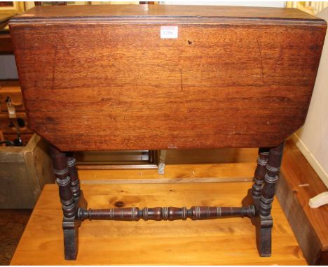 An Edwardian walnut Sutherland table, raised on ring turned supports, width 59cm