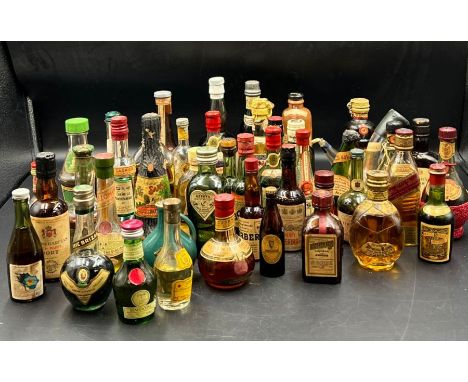 A collection of miniature bottle spirits and liqueurs including Johnie Walker whisky, port, brandy