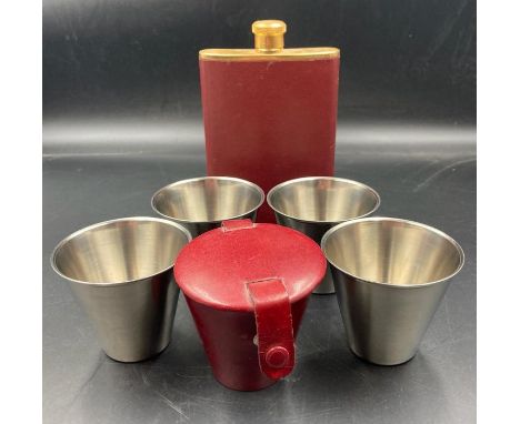 A Leather cased set of stirrup cups and gold plated hip flask