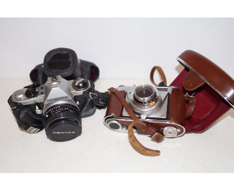 Kodac camera together with a Pemtax camera