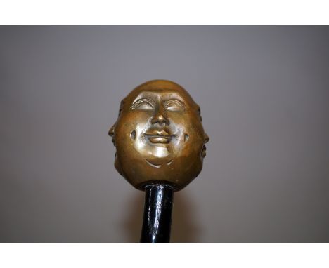 Walking cane with four-face Buddha finial