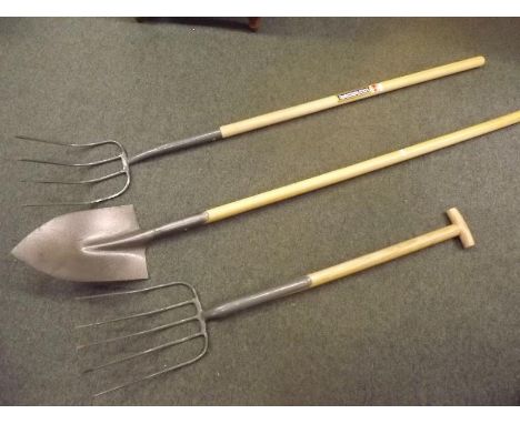 A long handled garden fork, a short handled garden fork and a trowel by Caldwells all unused