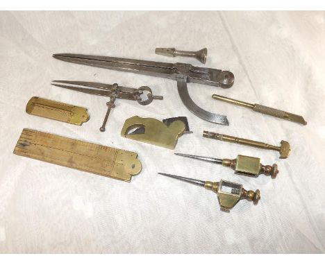 A good mixed lot of early period tools to include a Rabone sectional ruler # 1107, a small Lufkin boxwood ruler # 171, a bras