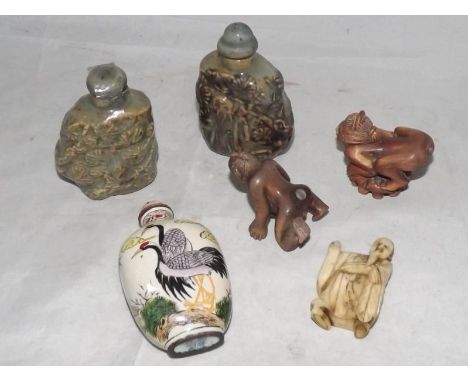 An ivory Netsuke, 5.4 cm (h), a collection of three Oriental snuff bottles and a pair of novelty errotic Netsukes