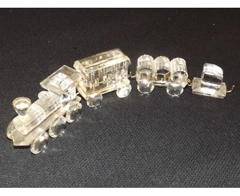 Swarovski Crystal - four figures depicting an Olde Wild West steam engine set on wooden plinth - Est £40 - £60