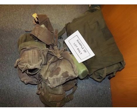 Two army back packs and a quantity of webbing