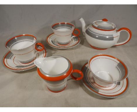 Shelley - A two place setting Art Deco tea service by Shelley hand painted in shades of orange and grey on a white ground - E