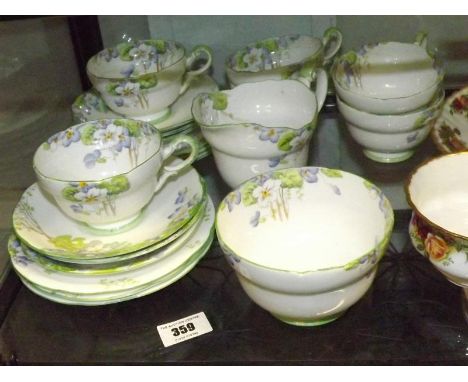 A mid 20th century hand-painted six-place setting tea service by Royal Paragon decorated as a replica of a service made for H
