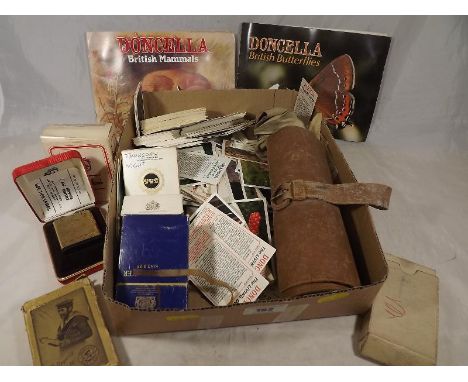 A good mixed lot to include cigarette cards, vintage playing cards, leather bound drawing kit and a Colibri lighter, boxed