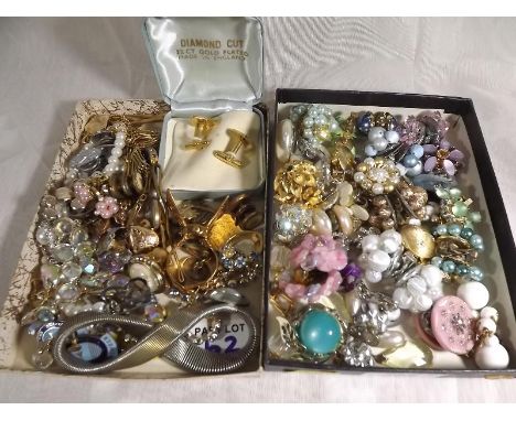 A quantity of costume jewellery to include paired earrings, gate bracelet, pin badges, cuff links, a lady's silver dress ring