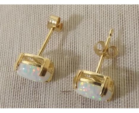 A 9ct gold pair of stud earrings set with opal