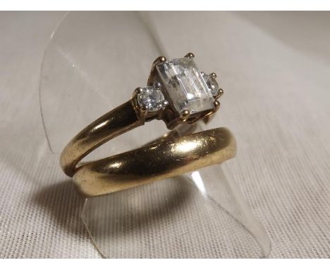 A 9ct gold wedding band and a lady's 9ct gold dress ring set with CZ, approximate weight 6.48 grams - Est £30 - £50