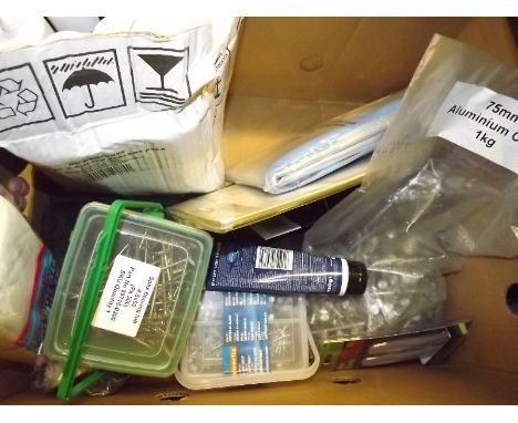A quantity of unused tools and hardware predominately nails, roof and gutter sealant, screws and similar 