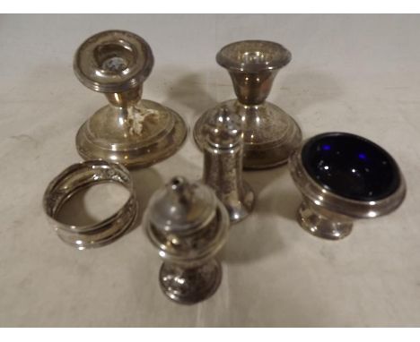 A small collection of  hallmarked silver to include candlesticks, cruets and a napkin ring various hallmarks (part a/f) 