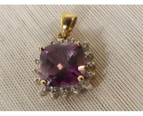 A 9ct gold pendant set with amethyst and diamon