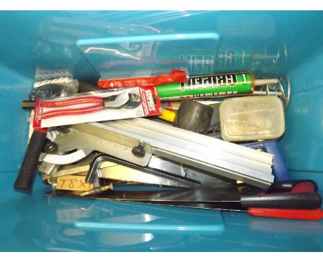 A storage box containing a quantity of tools to include hammers, screws, Kennedy heavy duty cable cutters, saws and other.