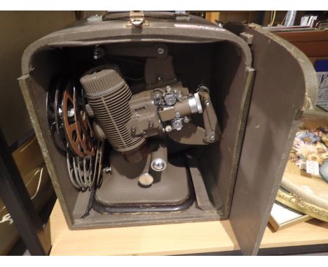 Bell &amp; Howell model 613 projector, lacking power lead and seven spare reels. Not available for in-house P&amp;P, contact 