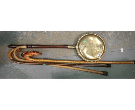 Three vintage walking sticks one with fox head and a vintage brass bed warmer. Not available for in-house P&amp;P, contact Pa