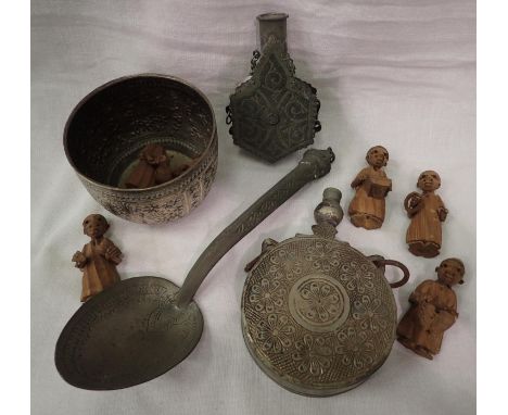Two white metal powder flasks and a similar bowl, spoon and some hand carved ethnic figures. P&amp;P Group 2 (£18+VAT for the