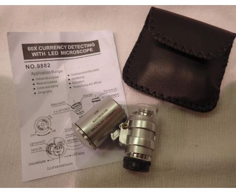Cased 60x currency/jewellery detecting loupe with LED light batteries etc. P&amp;P Group 1 (£14+VAT for the first lot and £1+