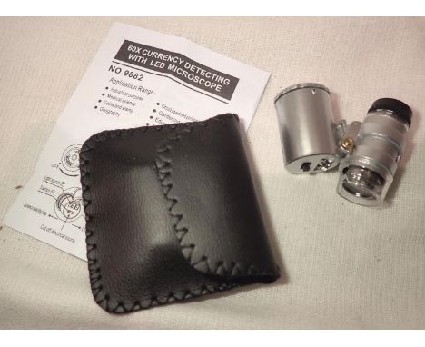 Cased 60x currency/jewellery detecting loupe with LED light batteries etc. P&amp;P Group 1 (£14+VAT for the first lot and £1+