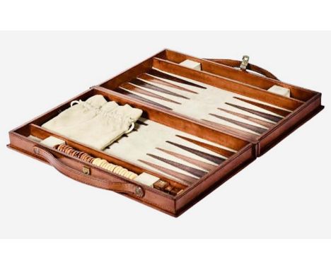 BACKGAMMON SET, leathered case, 7cm x 24cm x 40cm.