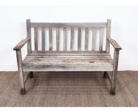 GARDEN BENCH BY BARLOW TYRIE, weathered teak, 85cm H x 119cm W x 59cm D.