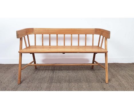 BENCH, wooden with spindle back raised on stretchered supports, 75cm H x 126cm W x 45cm D.