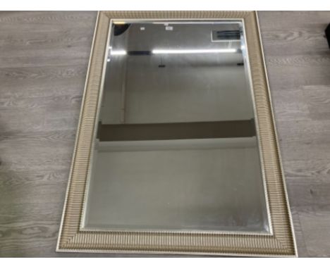 A LARGE MODERN BEVELLED WALL MIRROR IN SILVER FRAME 130 X 90CM