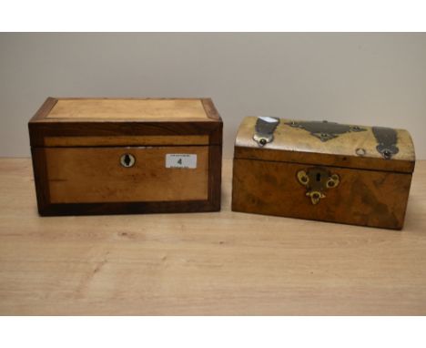 A 19th century satinwood tea caddy of rectangular form, having a rosewood border, hinged  lid and mother-of-pearl onset escut