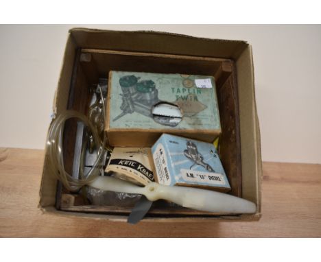 A box containing various aeroplane modelling parts, to include propellers, an air and water twin compression cylinder, a A.M.