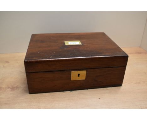 A fitted Rosewood lapdesk with leather skiver and fitted inkwell having brass fittings