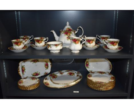 A Royal Albert bone China Old Country Roses pattern dinner service of lobed globular form, embellished throughout with gilt e