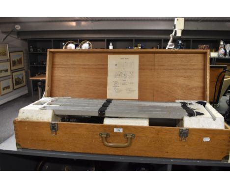 A vintage Astronomical telescope with tripod, cased in an oak box, stamped 'japan', L94cm