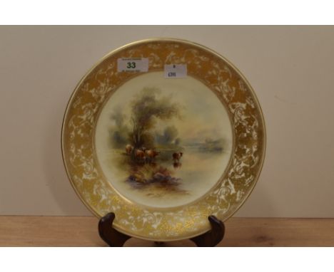 An early 20th century hand painted Royal Worcester bone China plate, the centre painted with cattle scene bordered by gilt fo
