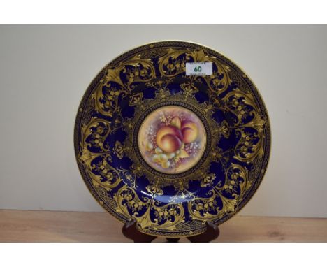 An attractive Royal Worcester fine bone China plate, hand painted with peaches and grape's bordered with a symetrical gilt pa