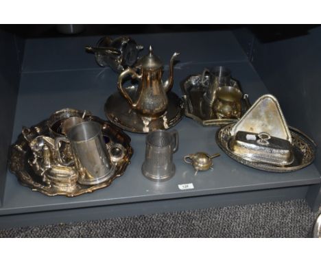 A large selection of silver plated dinner and tea ware, to include tankards, a lidded butter dish, coffee pot, serving tray, 