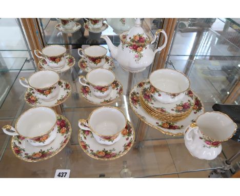 A Royal Albert Country Roses six person tea set including tea pot and sandwich plate, sugar bowl, milk jug - in used but good