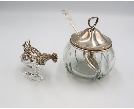 A Continental 800 silver topped salt in the form of a chicken or cockerell with outstretched neck, and matching spoon, togeth
