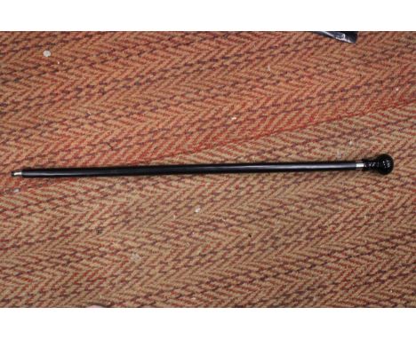 A TWO PIECE WALKING STICK WITH SPITFIRE LOGO ON THE HANDLE